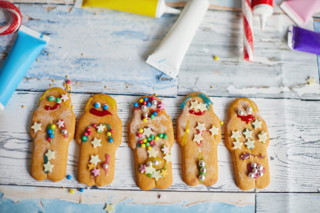 Gingerbread men decorated with sprinkles and icing