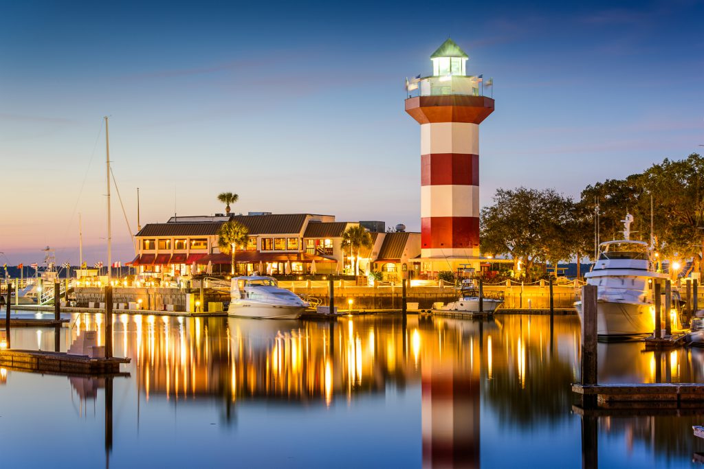 Hilton Head, South Carolina, USA lighthouse on the coast at twilight.